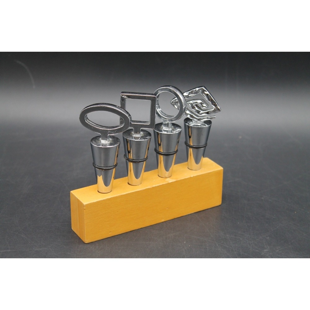 Set of 4 Decorative Wine Bottle Stoppers Chrome Tone Geometric Tops Wood Stand